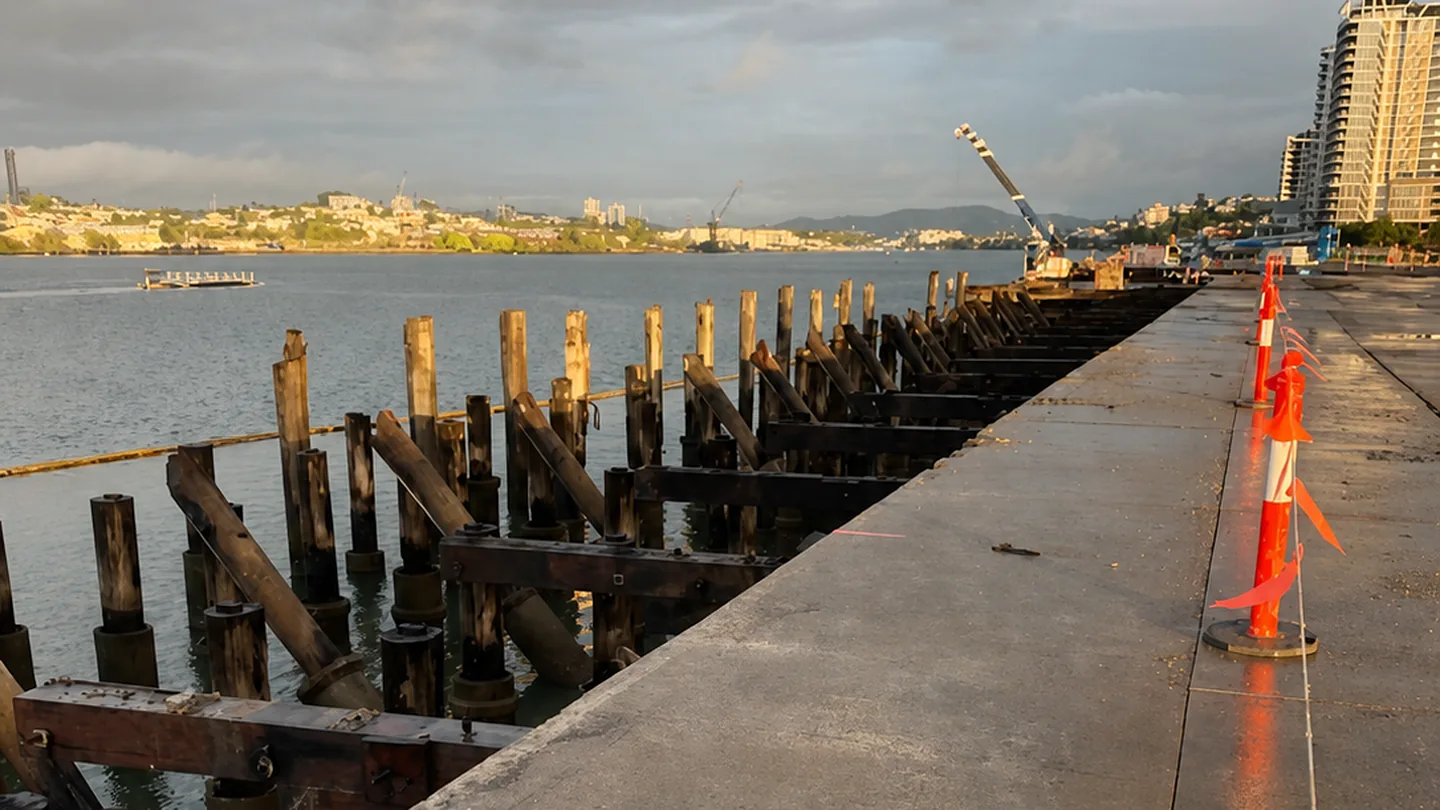 Hamilton Wharf demolition with exposed piles beside the Brisbane River